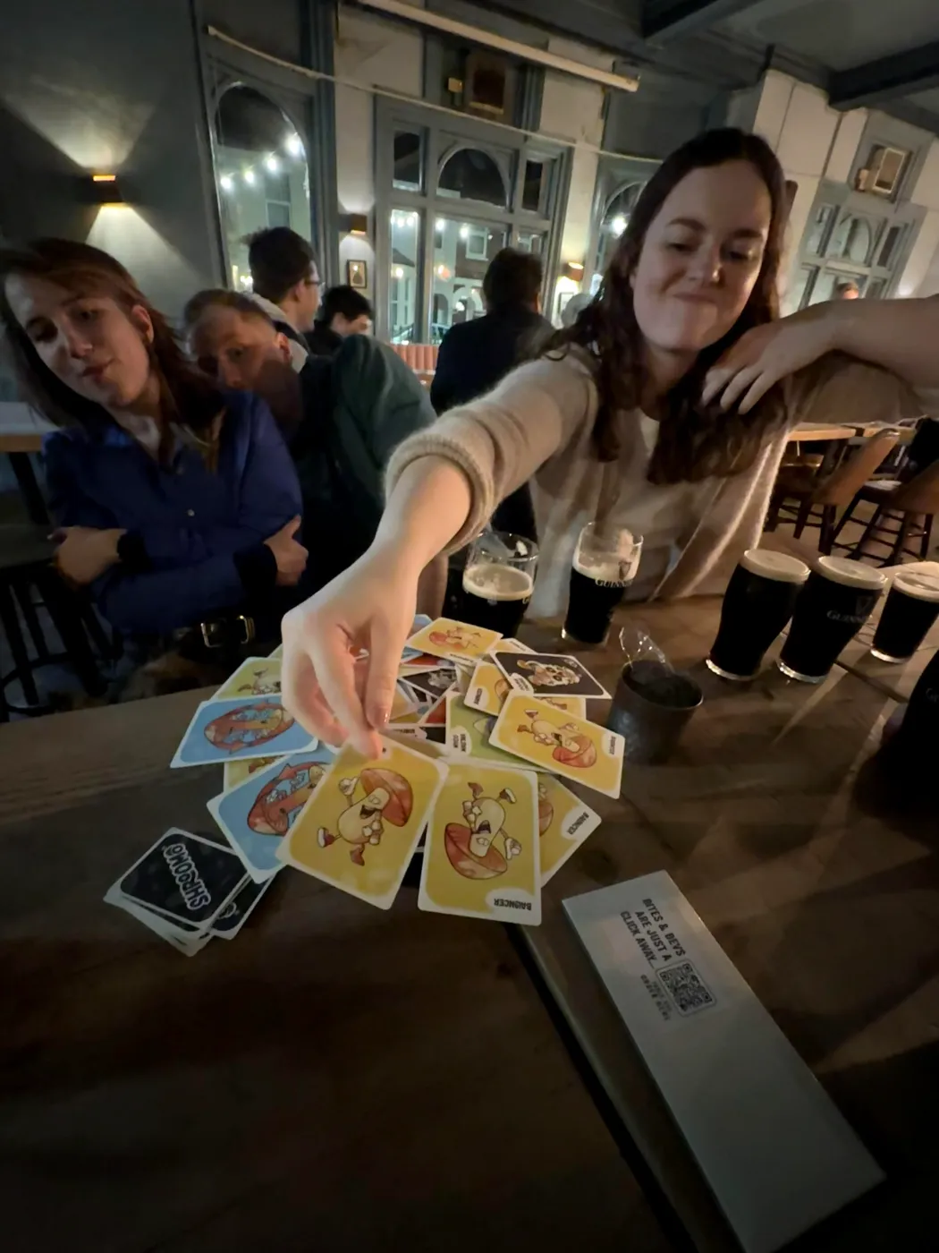 Shroomo balance card game in play at the pub with drinks